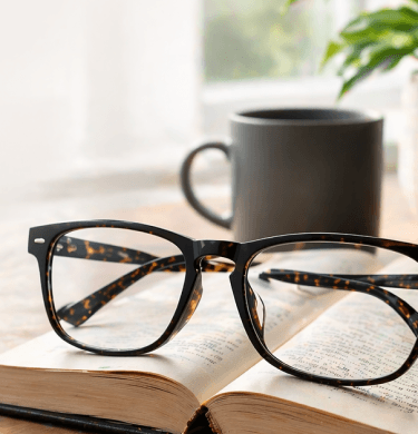 Reading glasses on an open book
